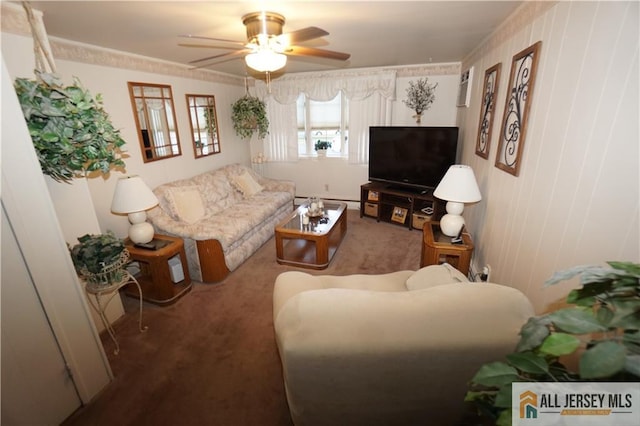 carpeted living room with ceiling fan