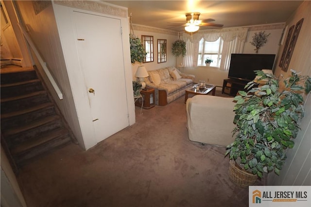 living room featuring carpet floors and ceiling fan