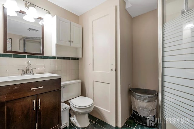 bathroom with vanity, an enclosed shower, tile patterned floors, and toilet
