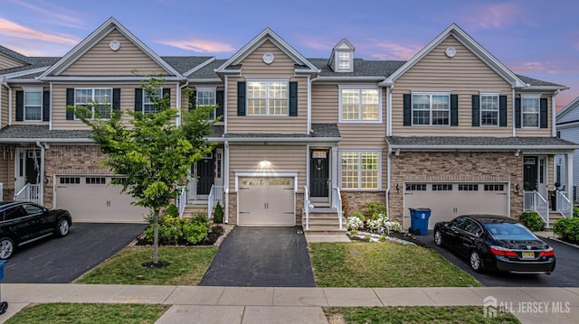 22 Larkspur Ln, Monroe, NJ 08831 - townhome / multi-family property with an attached garage and driveway
