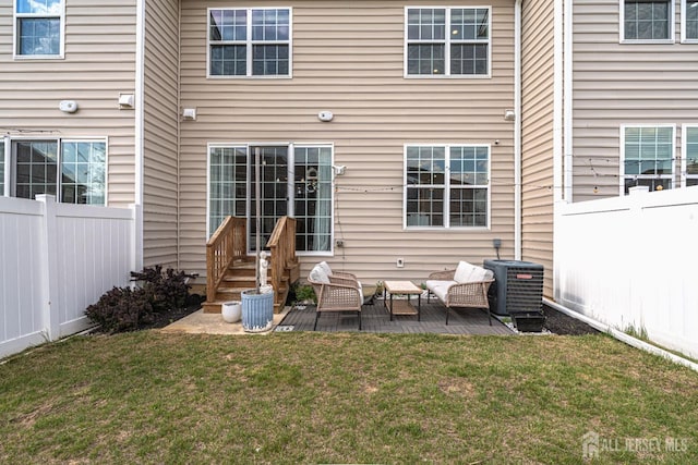 22 Larkspur Ln, Monroe, NJ 08831 - rear view of house featuring a fenced backyard, a patio area, and an outdoor hangout area