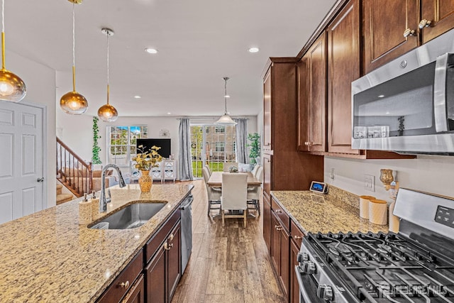 22 Larkspur Ln, Monroe, NJ 08831 - kitchen featuring stainless steel appliances, hardwood / wood-style flooring, decorative light fixtures, light stone counters, and recessed lighting