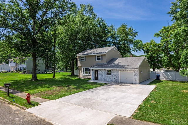 view of front of property with a garage and a front yard