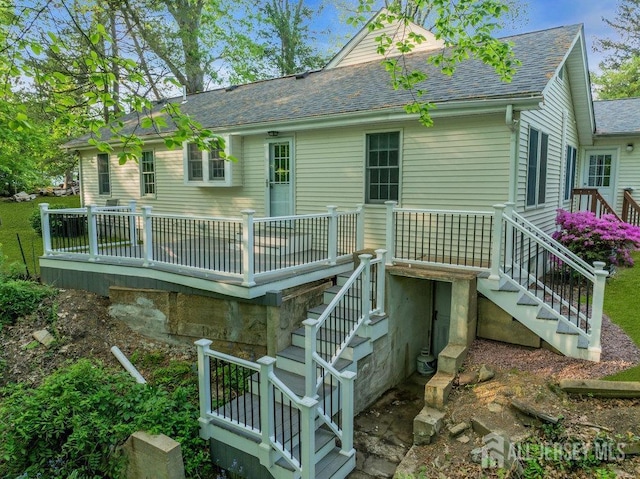 74 Ravine Dr, Matawan, NJ 07747 - rear view of property with a shingled roof, stairway, and a deck