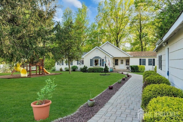 74 Ravine Dr, Matawan, NJ 07747 - view of green lawn featuring a playground
