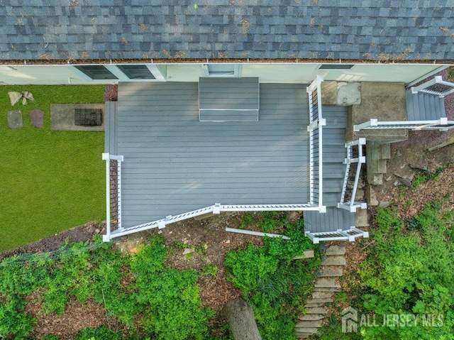 74 Ravine Dr, Matawan, NJ 07747 - view of property exterior with roof with shingles