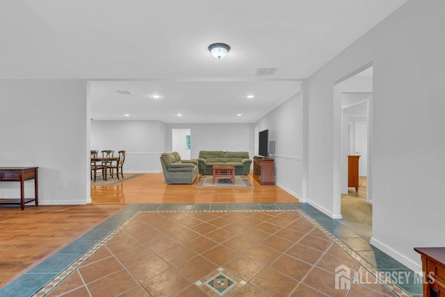 74 Ravine Dr, Matawan, NJ 07747 - tiled living room featuring inlaid floor details and recessed lighting