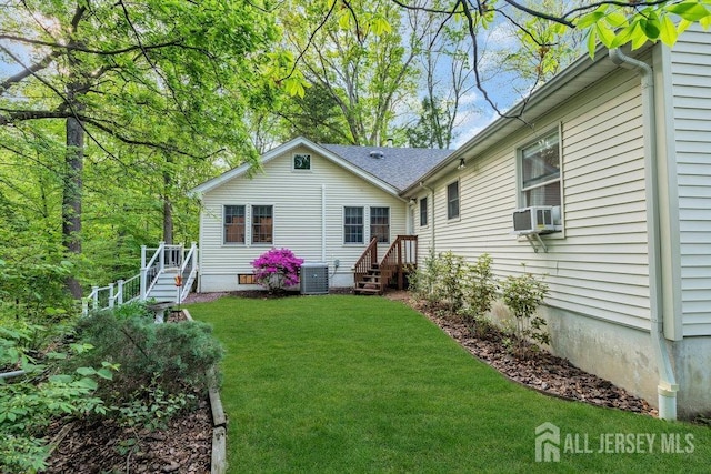 74 Ravine Dr, Matawan, NJ 07747 - rear view of property featuring a yard and cooling unit