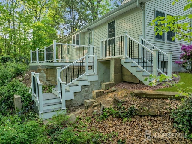 74 Ravine Dr, Matawan, NJ 07747 - view of home's exterior with stairway and a deck