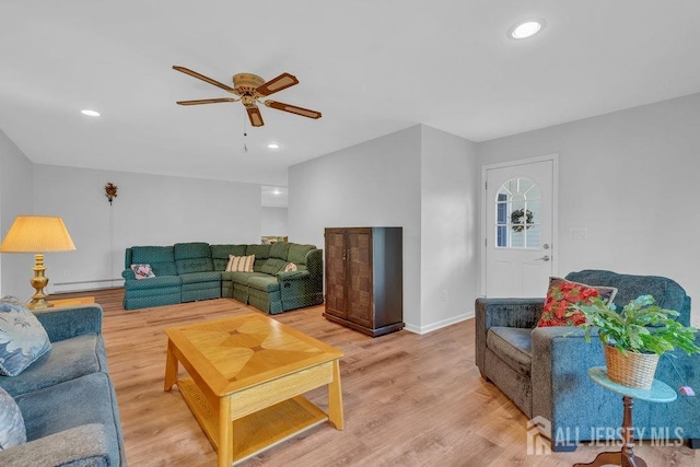74 Ravine Dr, Matawan, NJ 07747 - living area featuring baseboard heating, a ceiling fan, light wood finished floors, and recessed lighting
