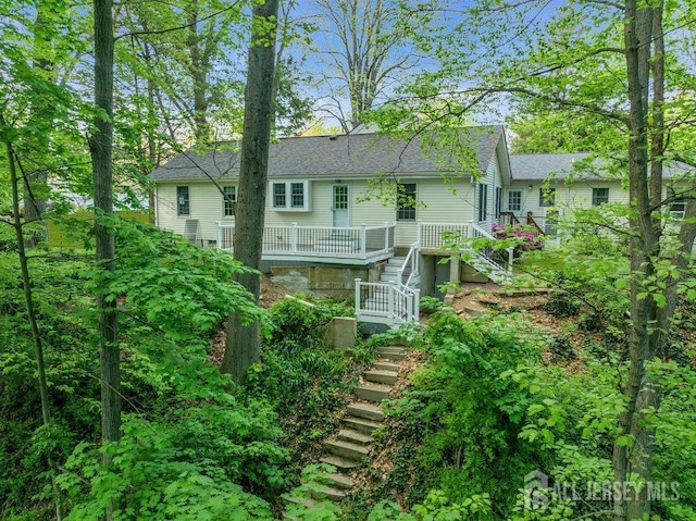 74 Ravine Dr, Matawan, NJ 07747 - back of house featuring stairway and a shingled roof