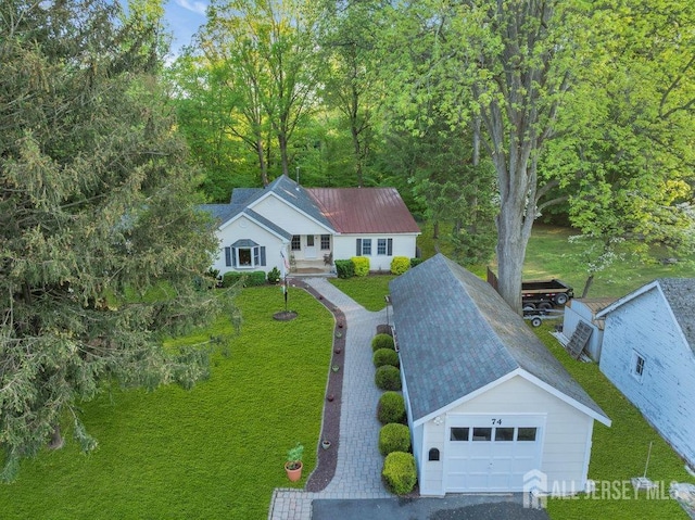 74 Ravine Dr, Matawan, NJ 07747 - view of front facade with a detached garage and a front lawn