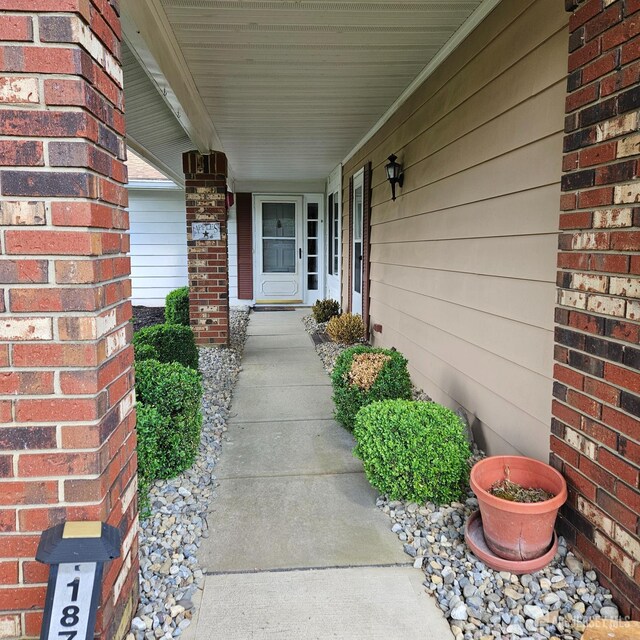 187 Newport Rd Unit A, Monroe, NJ 08831 - view of exterior entry with covered porch and brick siding