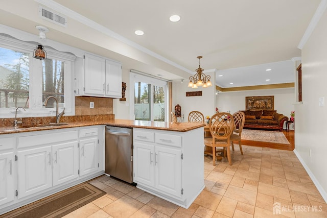kitchen featuring stone countertops, dishwasher, visible vents, a sink, and white cabinets