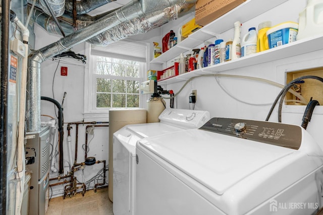 laundry area with laundry area and washer and dryer
