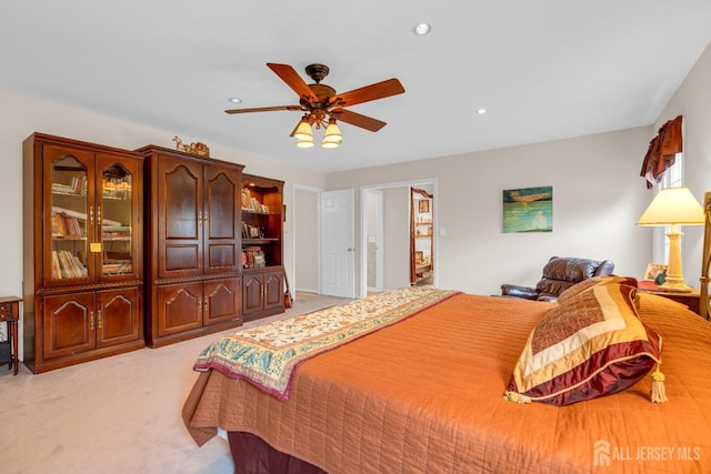 bedroom featuring ceiling fan, light carpet, and recessed lighting