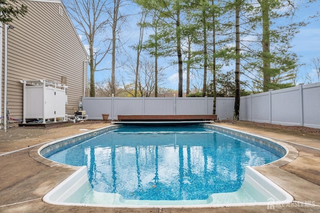 view of swimming pool featuring a fenced in pool and a fenced backyard