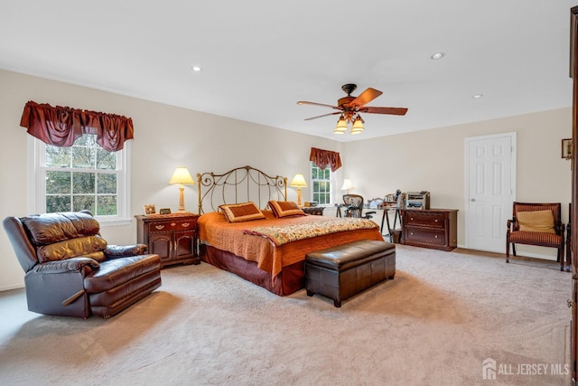 bedroom featuring light carpet, ceiling fan, and recessed lighting