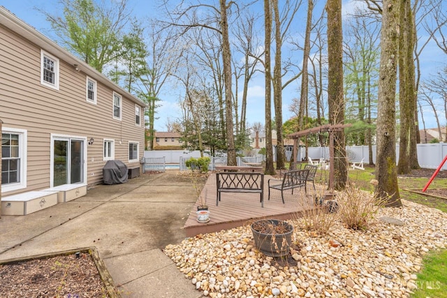 exterior space with a fenced backyard and grilling area
