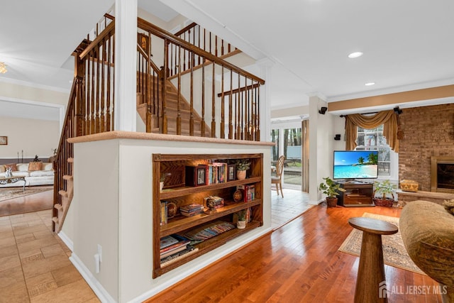 interior space with baseboards, stairs, recessed lighting, and crown molding