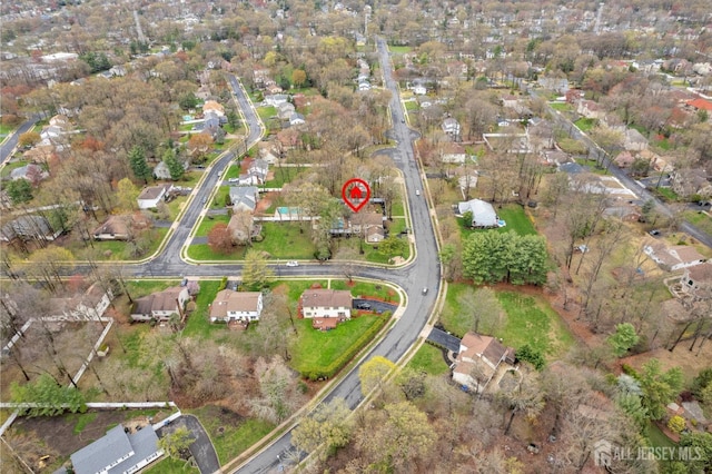 birds eye view of property with a residential view
