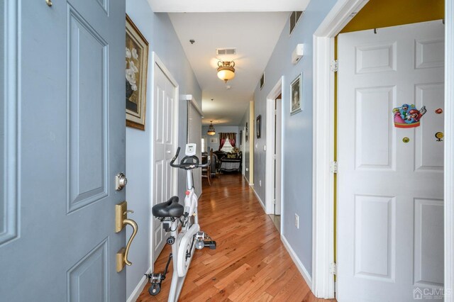 hallway featuring light wood-type flooring