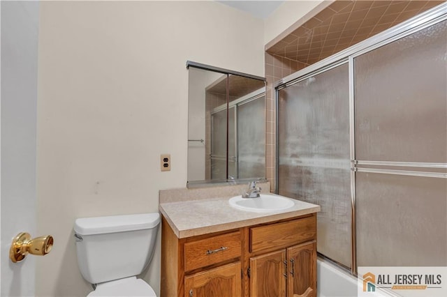 bathroom with toilet and vanity