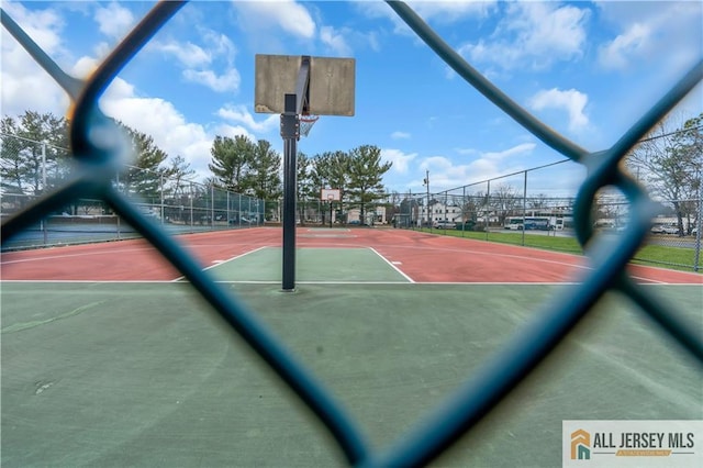 view of sport court with community basketball court and fence