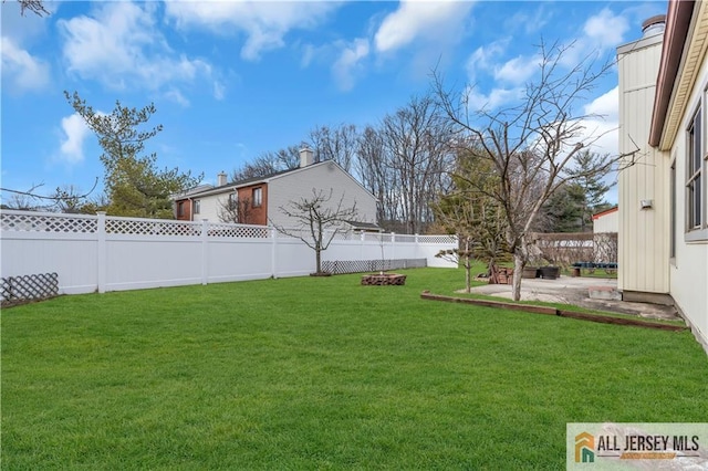 view of yard featuring a fenced backyard and a patio area