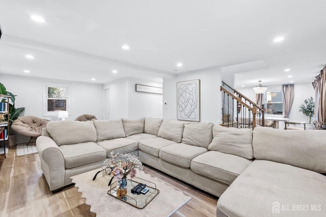 living area with stairway, recessed lighting, and light wood-style floors