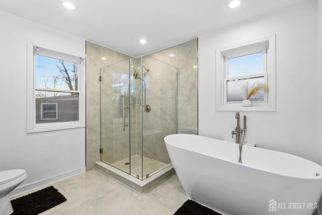 full bath featuring baseboards, toilet, a soaking tub, a shower stall, and recessed lighting