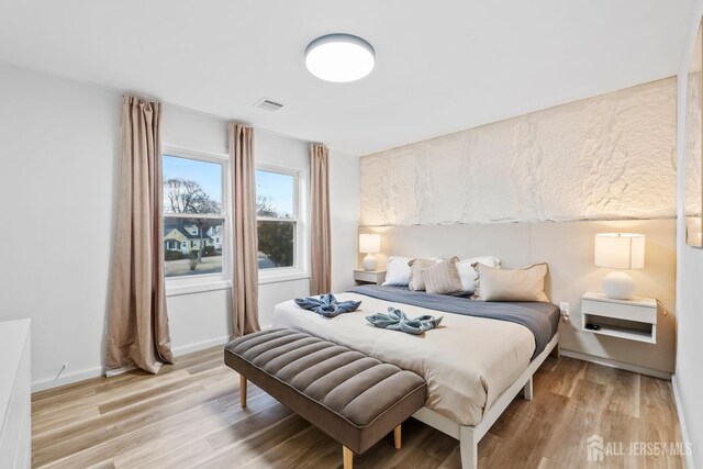 bedroom featuring light hardwood / wood-style floors