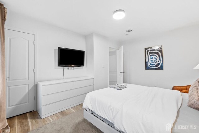 bedroom featuring light wood-type flooring