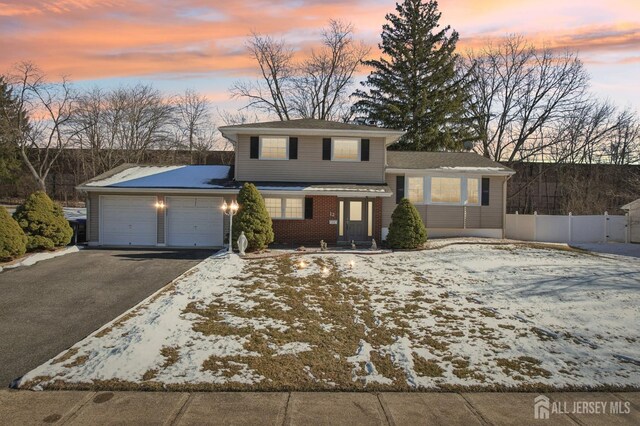 view of front of property featuring a garage