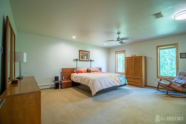 bedroom with a baseboard heating unit, light carpet, baseboards, ceiling fan, and recessed lighting