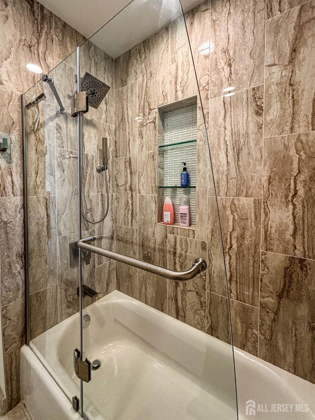 full bathroom featuring combined bath / shower with glass door