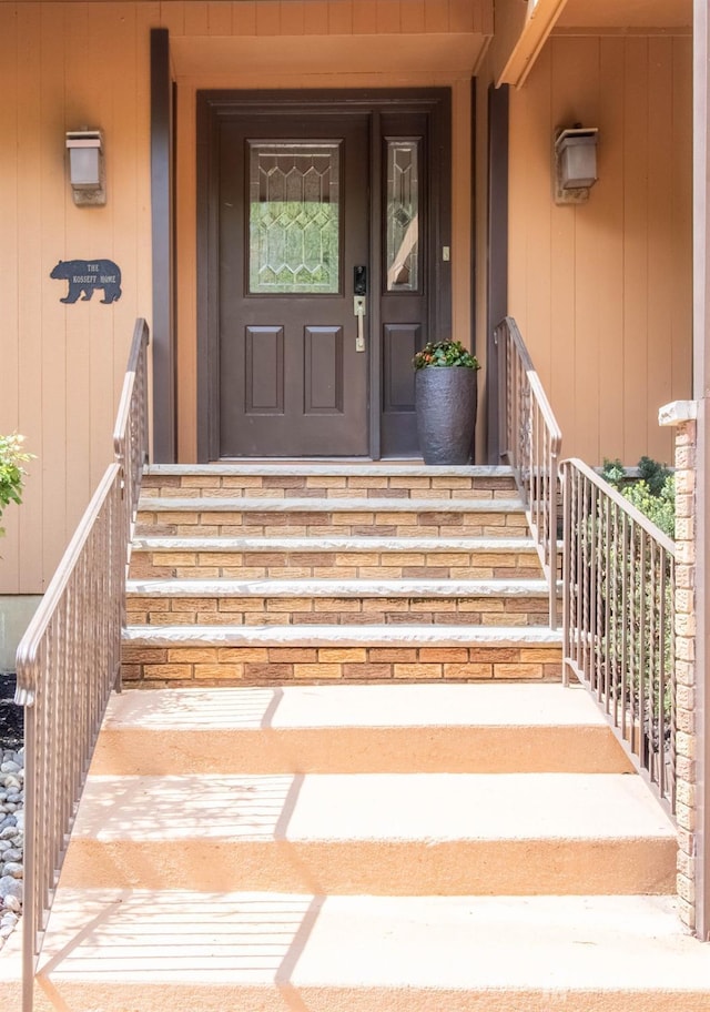 view of exterior entry with a porch
