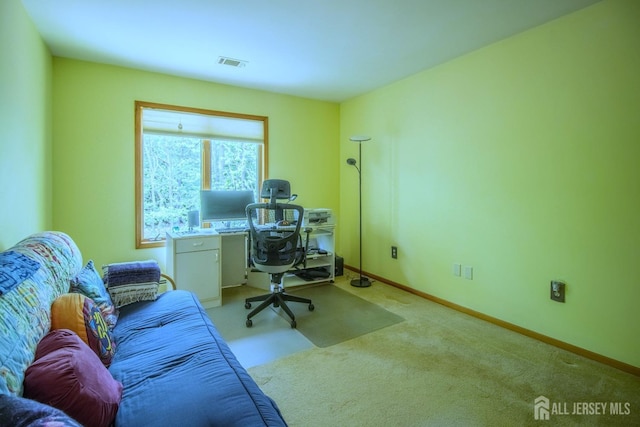 office space with light carpet and baseboards