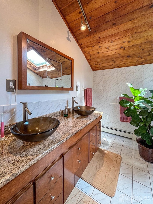 bathroom featuring wood ceiling, a baseboard radiator, lofted ceiling, track lighting, and a skylight