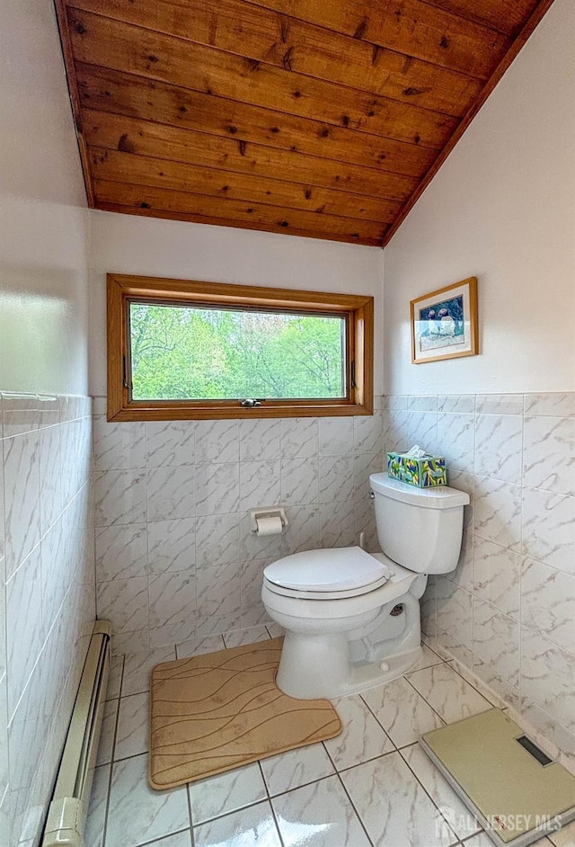 half bathroom with marble finish floors, wood ceiling, toilet, healthy amount of natural light, and vaulted ceiling