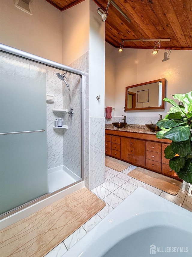 bathroom featuring wood ceiling, a stall shower, double vanity, and a wainscoted wall