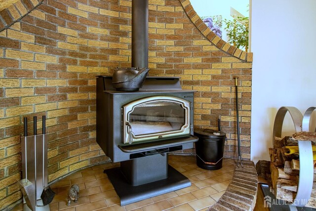 detailed view of a wood stove and brick wall