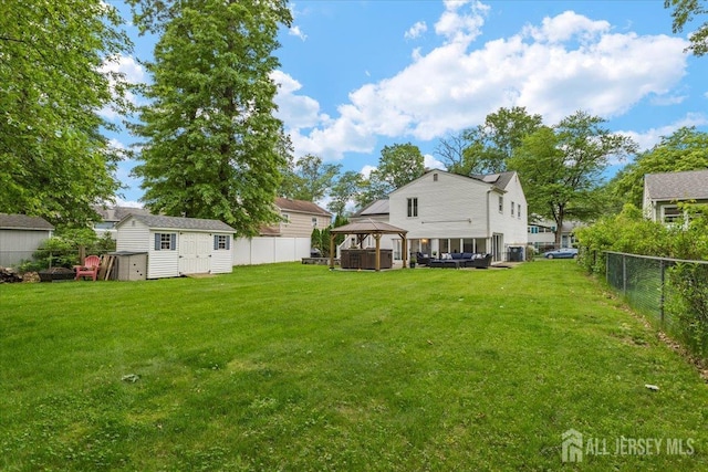 606 Hayward St, Bound Brook, NJ 08805 - fenced backyard featuring a gazebo and a shed