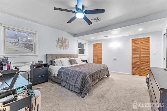 606 Hayward St, Bound Brook, NJ 08805 - bedroom with light colored carpet, recessed lighting, multiple closets, multiple windows, and a ceiling fan