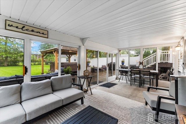 606 Hayward St, Bound Brook, NJ 08805 - sunroom featuring a jacuzzi, outdoor dining space, an outdoor living space, and a wooden deck