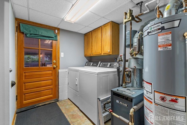 606 Hayward St, Bound Brook, NJ 08805 - laundry room with gas water heater, cabinet space, washing machine and clothes dryer, and a heating unit