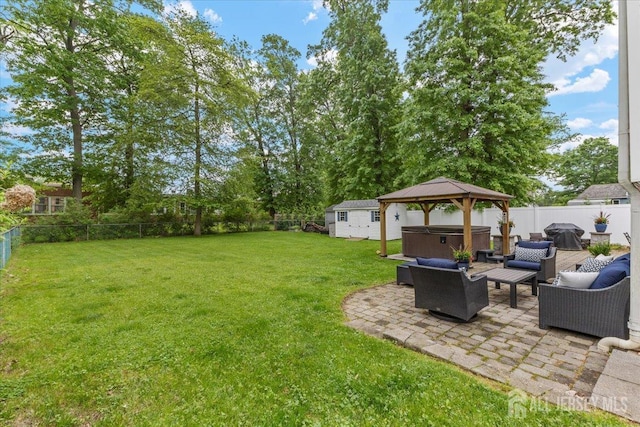606 Hayward St, Bound Brook, NJ 08805 - fenced backyard with a hot tub, a patio area, outdoor lounge area, and a gazebo
