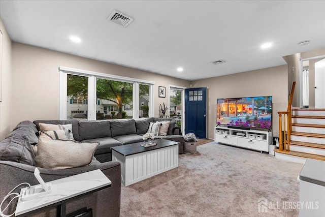 606 Hayward St, Bound Brook, NJ 08805 - carpeted living room with recessed lighting and stairs