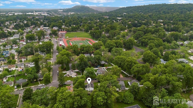 606 Hayward St, Bound Brook, NJ 08805 - aerial overview of property's location featuring a mountain backdrop and a forest