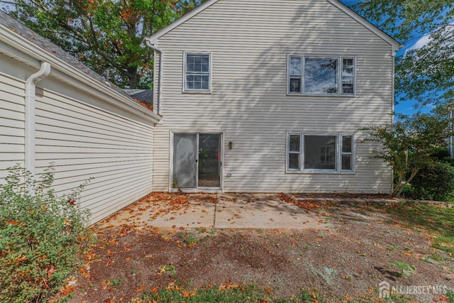 rear view of property featuring a patio